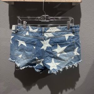 Blue Jean shorts with white stars on them